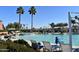 Exterior view of a resort-style pool with palm trees, lounge chairs, and desert landscaping at 19892 N Shadow Mountain Dr, Surprise, AZ 85374