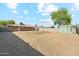 A backyard with a storage shed and completely covered in decorative rock at 2015 W Weldon Ave, Phoenix, AZ 85015