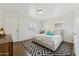 Bright bedroom with a modern bed frame, geometric rug and two windows at 2015 W Weldon Ave, Phoenix, AZ 85015