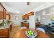Charming kitchen and dining area with wood cabinetry, granite countertops, and stainless steel appliances at 2015 W Weldon Ave, Phoenix, AZ 85015