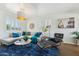 Inviting living room showcasing a comfortable sectional sofa, decorative rug, and sunny windows at 2015 W Weldon Ave, Phoenix, AZ 85015