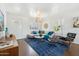 Bright living room featuring a sectional sofa, stylish rug, and modern decor at 2015 W Weldon Ave, Phoenix, AZ 85015