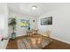 This office has a small desk, two chairs, a houseplant, and a window with natural light at 2015 W Weldon Ave, Phoenix, AZ 85015