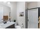 Nicely appointed bathroom features black hardware, framed mirror, and shower with black trim at 2114 N Canelo Hls, Mesa, AZ 85207