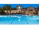 Sparkling community pool with a backdrop of the clubhouse and desert landscape at 2114 N Canelo Hls, Mesa, AZ 85207