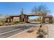 Community entrance with stone gate and desert landscaping at 2114 N Canelo Hls, Mesa, AZ 85207