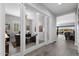 Bright hallway featuring stylish tile floors and a view of a home office at 2114 N Canelo Hls, Mesa, AZ 85207