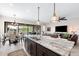Spacious kitchen with granite countertops, stainless appliances, opening to living area and backyard at 2114 N Canelo Hls, Mesa, AZ 85207