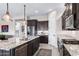 Modern kitchen features stainless steel appliances, granite countertops, and center island at 2114 N Canelo Hls, Mesa, AZ 85207