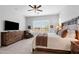 Spacious main bedroom with a large window, plantation shutters, and a cozy seating area, creating a relaxing retreat at 2114 N Canelo Hls, Mesa, AZ 85207