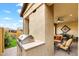 Outdoor kitchen features a built-in grill and counter space, convenient for outdoor cooking and entertaining on the patio at 2114 N Canelo Hls, Mesa, AZ 85207