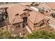 Expansive aerial view of the property featuring desert landscaping and a grand entryway at 21200 E Camacho Rd, Queen Creek, AZ 85142