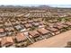 Charming aerial shot of desert home boasting backyard oasis with pool, covered patio, and lush landscaping at 21200 E Camacho Rd, Queen Creek, AZ 85142