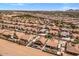 Stunning aerial view of desert home featuring sparkling pool, extended patio and well-manicured backyard at 21200 E Camacho Rd, Queen Creek, AZ 85142