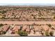 Expansive aerial view of a desert home featuring a large lot, RV parking, and a refreshing private pool at 21200 E Camacho Rd, Queen Creek, AZ 85142