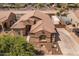 Expansive aerial view of the property featuring desert landscaping and a grand entryway at 21200 E Camacho Rd, Queen Creek, AZ 85142