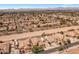 Expansive aerial view of a desert home featuring a large lot, RV parking, and a refreshing private pool at 21200 E Camacho Rd, Queen Creek, AZ 85142