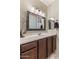 Bathroom vanity featuring elegant mirror and marble countertop at 21200 E Camacho Rd, Queen Creek, AZ 85142