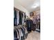 Walk-in closet with ample storage and organization racks for clothes and accessories at 21200 E Camacho Rd, Queen Creek, AZ 85142