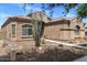 Attractive single-story house boasting desert landscaping for low maintenance at 21200 E Camacho Rd, Queen Creek, AZ 85142