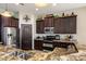 Lovely kitchen showcasing granite countertops and stainless steel appliances at 21200 E Camacho Rd, Queen Creek, AZ 85142