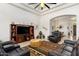 Spacious living room featuring a built-in entertainment center and comfortable seating at 21200 E Camacho Rd, Queen Creek, AZ 85142