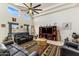 Bright living room with vaulted ceiling, clerestory windows, and stylish ceiling fan at 21200 E Camacho Rd, Queen Creek, AZ 85142