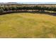 The grassy area of a community park is well kept and spacious at 21200 E Camacho Rd, Queen Creek, AZ 85142