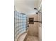 Luxurious shower with glass block wall and double shower heads at 21200 E Camacho Rd, Queen Creek, AZ 85142