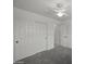 Bedroom with carpeting and closet with multiple doors for ample storage at 2152 E Casitas Del Rio Dr, Phoenix, AZ 85024