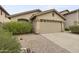 Charming home featuring a spacious two-car garage, desert landscape, and well-maintained front yard at 2152 E Casitas Del Rio Dr, Phoenix, AZ 85024