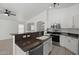 Kitchen island with granite countertops, stainless steel appliances, and a double sink at 2152 E Casitas Del Rio Dr, Phoenix, AZ 85024