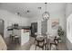 Eat-in kitchen with granite countertops, stainless steel appliances, breakfast bar, and dining area at 2152 E Casitas Del Rio Dr, Phoenix, AZ 85024