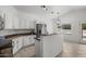 Modern kitchen featuring white cabinets, granite countertops, and stainless-steel appliances at 2152 E Casitas Del Rio Dr, Phoenix, AZ 85024