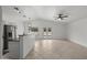 Open-concept living area with tile flooring, ceiling fan, and access to a patio at 2152 E Casitas Del Rio Dr, Phoenix, AZ 85024