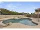 Backyard pool surrounded by mature landscaping and decorative rock accents at 2152 E Casitas Del Rio Dr, Phoenix, AZ 85024