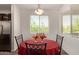 Bright dining area featuring a window view and seating for four at 22125 N 29Th Ave # 137, Phoenix, AZ 85027