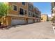 Townhome exterior showcasing multiple garages, offering ample parking and storage at 22125 N 29Th Ave # 137, Phoenix, AZ 85027