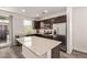 Modern kitchen featuring stainless steel appliances, granite countertops, and dark wood cabinets at 22125 N 29Th Ave # 137, Phoenix, AZ 85027
