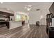 Open-concept living space with wood flooring, leading to the dining area and kitchen at 22125 N 29Th Ave # 137, Phoenix, AZ 85027