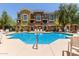 Community pool featuring seating and well-maintained landscaping for residents at 22125 N 29Th Ave # 137, Phoenix, AZ 85027