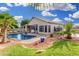 Serene backyard showcasing a private pool with a lush lawn and patio, perfect for outdoor entertaining at 22351 N 67Th Dr, Glendale, AZ 85310