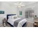 Bedroom showcasing a cozy bed, soft lighting and natural light from the large window, creating a peaceful ambiance at 22351 N 67Th Dr, Glendale, AZ 85310