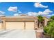Charming single-Gathering home with a two-car garage, stone accents, and low-maintenance landscaping at 22351 N 67Th Dr, Glendale, AZ 85310