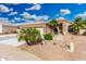 Attractive desert home with manicured landscaping, a two-car garage, and a covered front entrance at 22351 N 67Th Dr, Glendale, AZ 85310