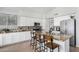 Modern kitchen with granite countertops, white cabinets, and stainless steel appliances at 22351 N 67Th Dr, Glendale, AZ 85310