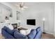 Cozy living room featuring a fireplace, TV, and comfortable seating at 22351 N 67Th Dr, Glendale, AZ 85310