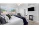 Bright main bedroom with a large window, carpet, and a ceiling fan at 22351 N 67Th Dr, Glendale, AZ 85310