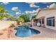 Gorgeous swimming pool featuring a rock waterfall and lush landscaping for a relaxing backyard oasis at 22351 N 67Th Dr, Glendale, AZ 85310