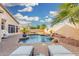 Beautiful backyard pool with rock features and mature landscaping for a private and tranquil retreat at 22351 N 67Th Dr, Glendale, AZ 85310